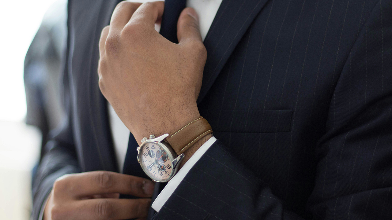 Man in a suit and beautiful expensive watch
