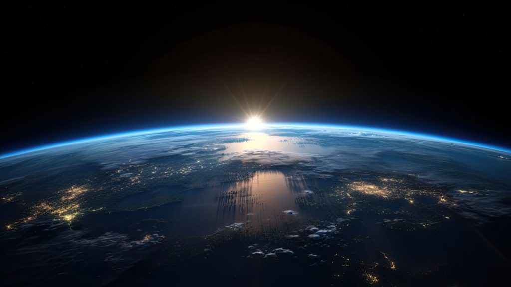 view of the sun rising over the earth.
