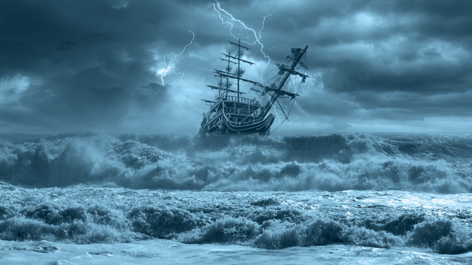 Sailing old ship in a storm sea in the background stormy clouds with lightning