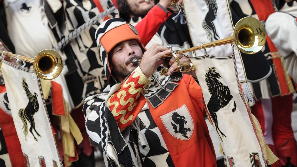 Every year in Arezzo's Piazza Grande is the Saracen Joust, a historical reenactment with knights and flag-wavers, musicians and people in costumed.