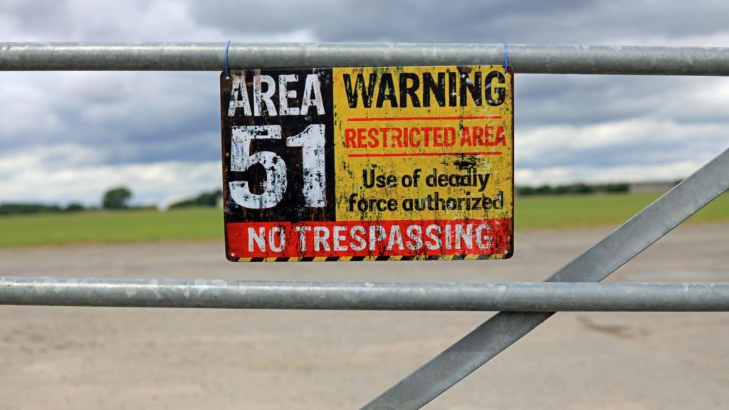 Area 51 Warning Sign Hanging On A Gate. Extraterrestrial Storage Facility Concept.
