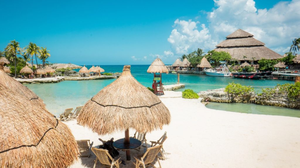 Caribbean beach and lagoon on a sunny day in summertime. Cancun, Mexico.