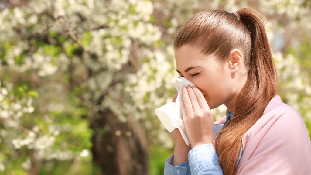 woman sneezing