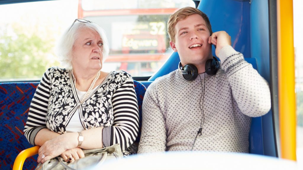 Man Disturbing Passengers On Bus Journey With Phone Call.