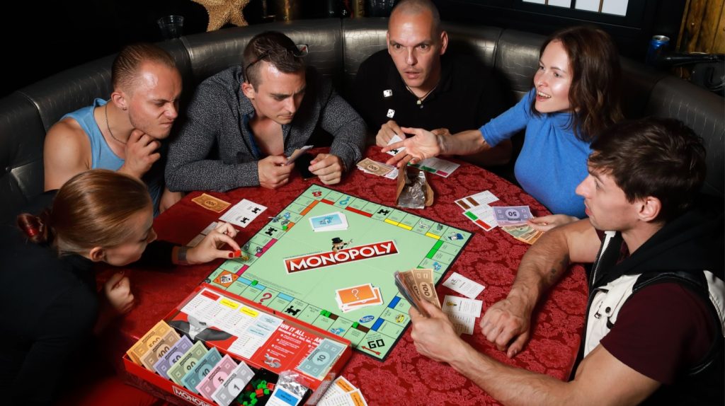 A group playing Monopoly