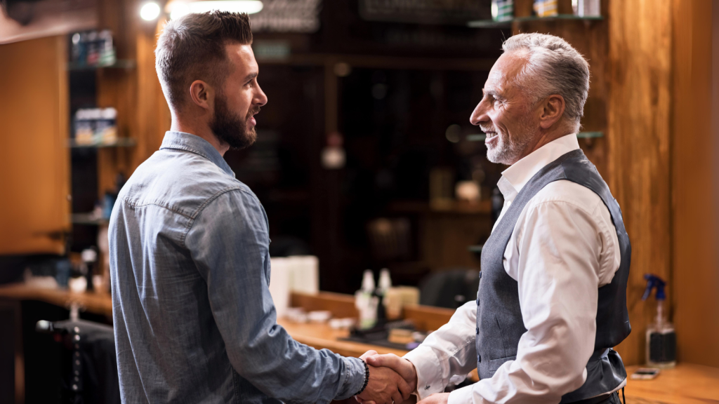 Barber and client shaking hands