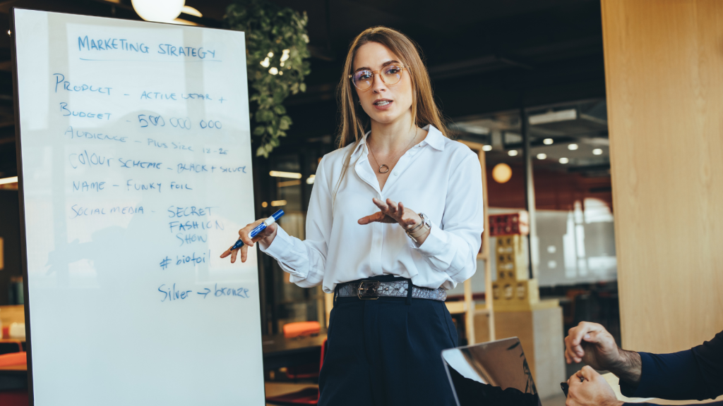 Confident young businesswoman giving a presentation