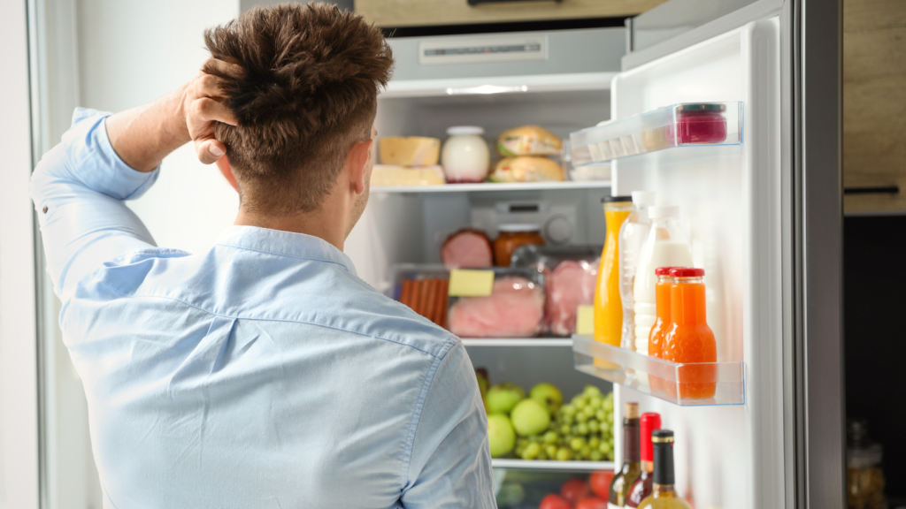 Man looking inside the fridge