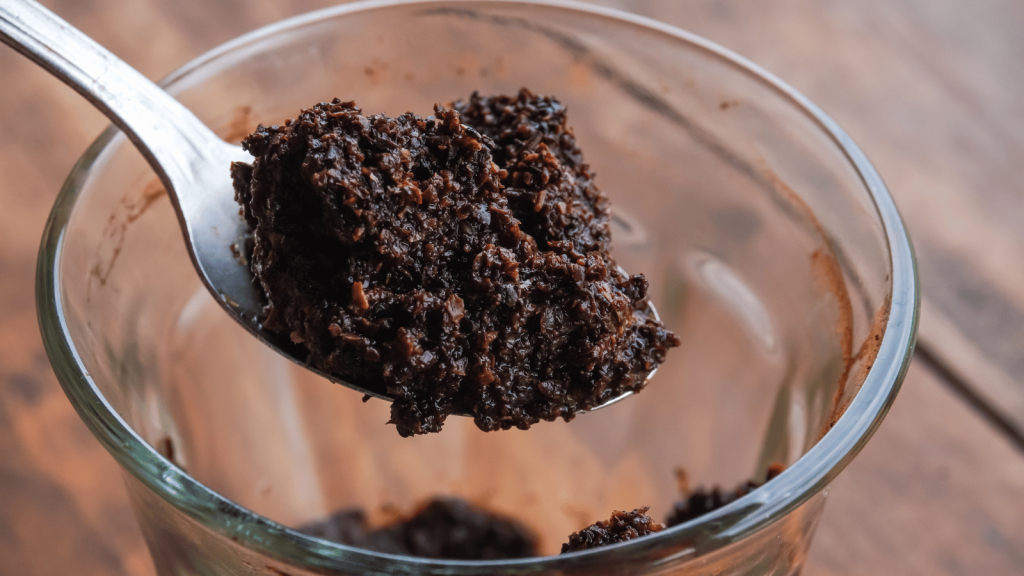 Coffee grounds on a spoon