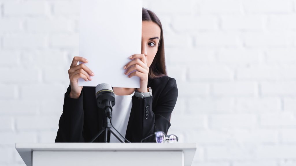 woman having social anxiety speaking ifnront