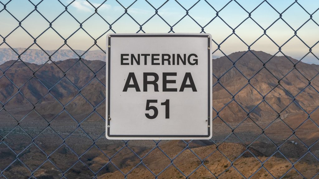 Entering Area 51 sign on fence