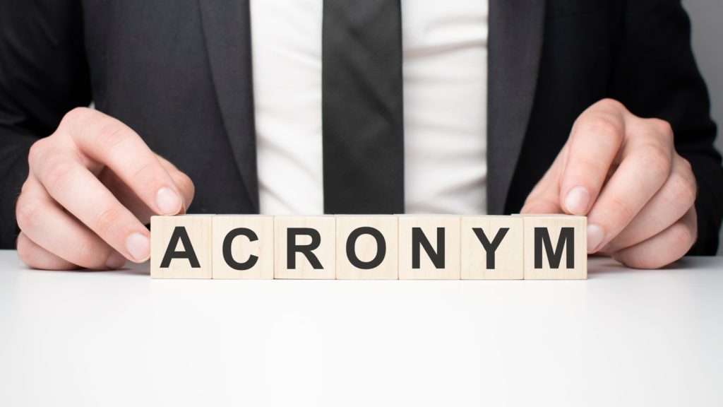 man arranging acronym