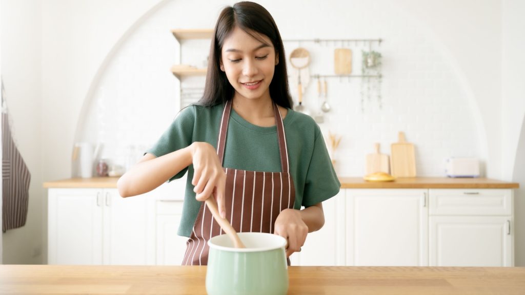 young woman cooking