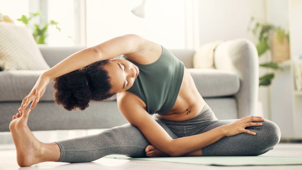 woman stretching in the morning, doing exercise