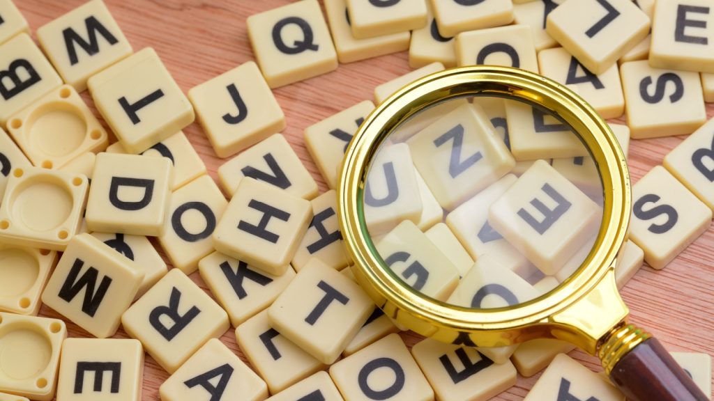 scrabble with magnifying glass