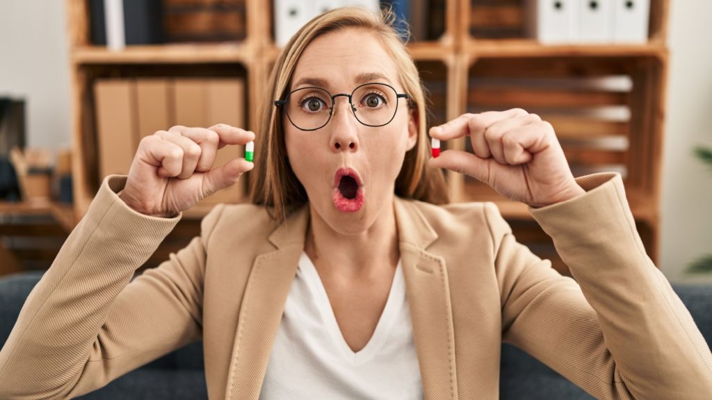 woman amazed by a pill