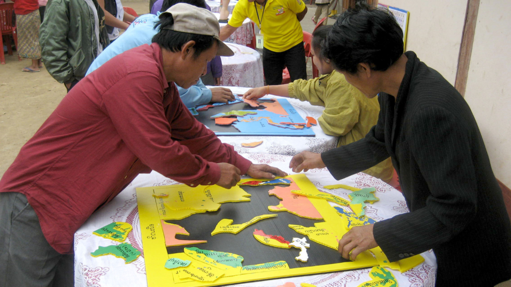 A group of people solving a jigsaw puzzle