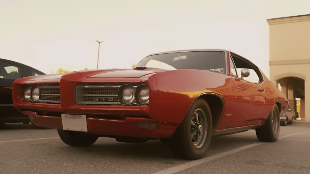 Vintage Pontiac GTO in a parking lot