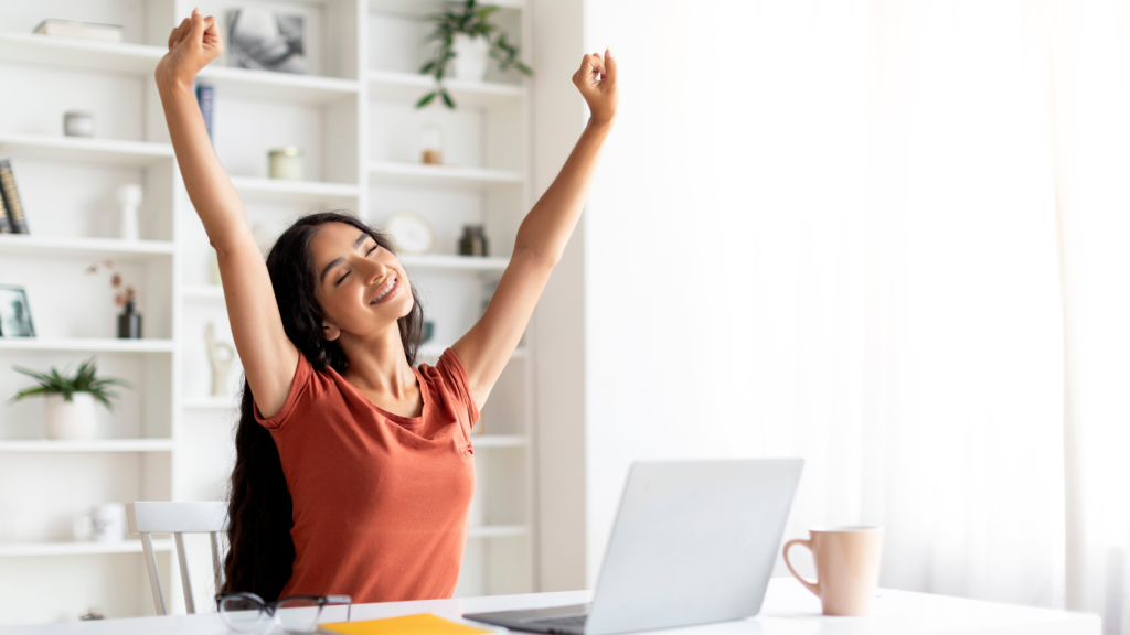 Woman stretching during working day at home office