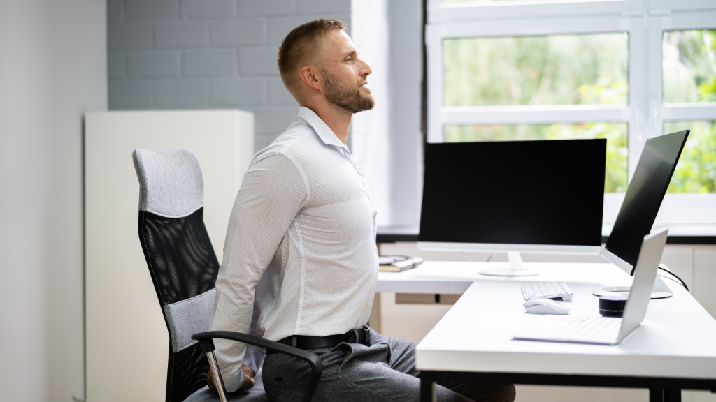 Man doing twisted torso while sitting