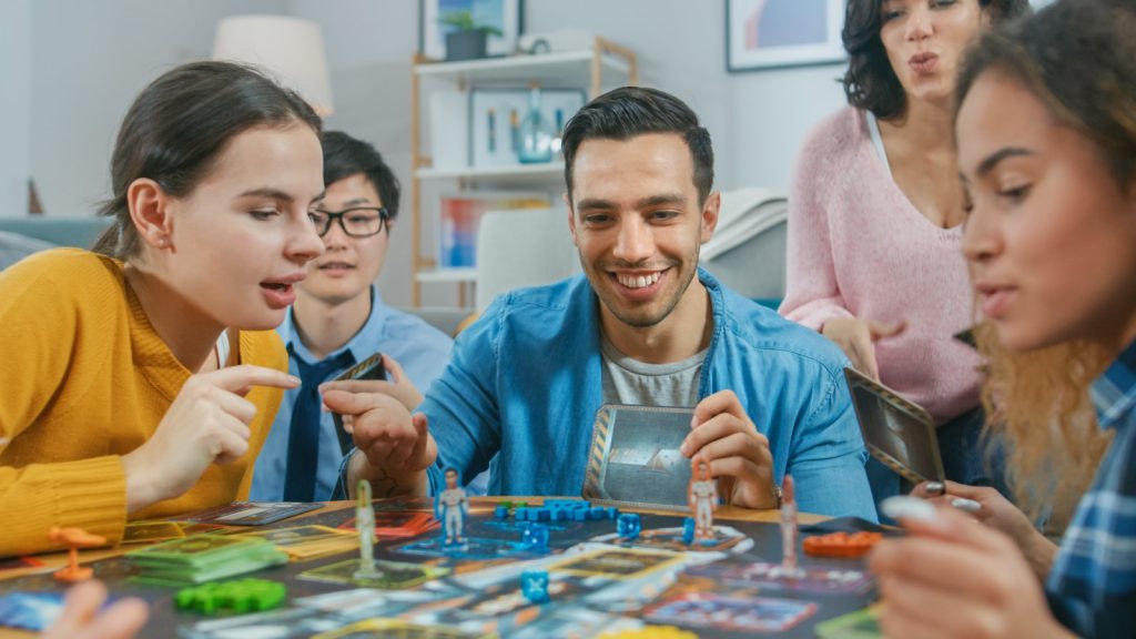 Playing board game, teamwork