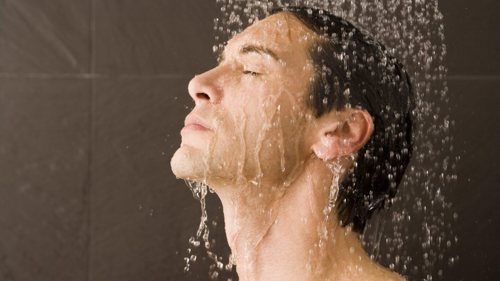 Man taking a cold shower in the morning