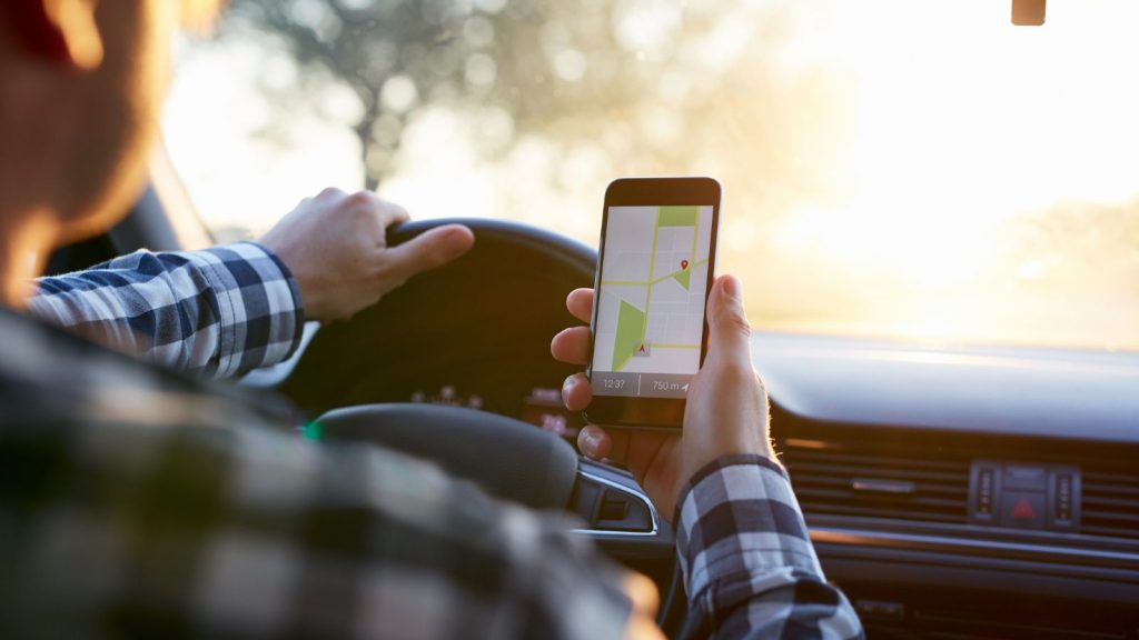 A man checking his mobile phone for map navigation