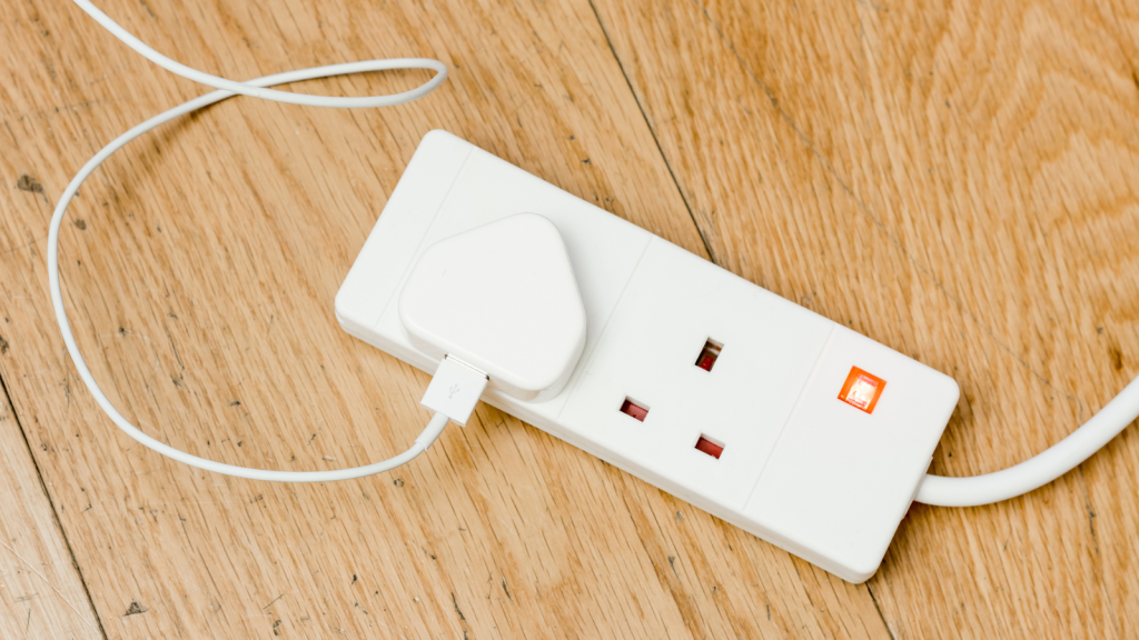 A white plastic extension power cord