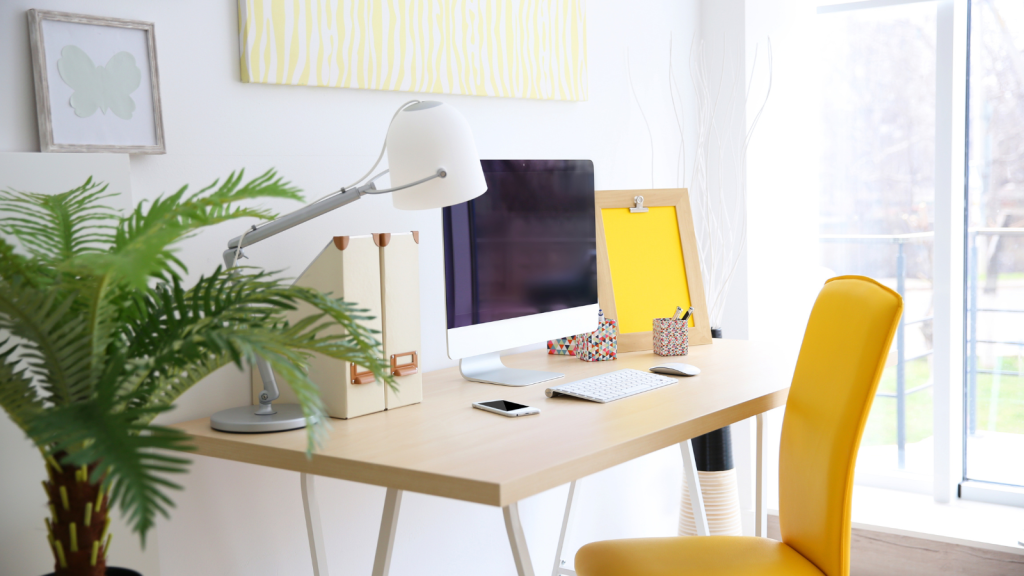 Image of a desk with a task lamp providing focused lighting on a workspace