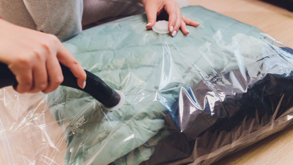 Image of vacuum storage bags neatly stacked and filled with bulky items