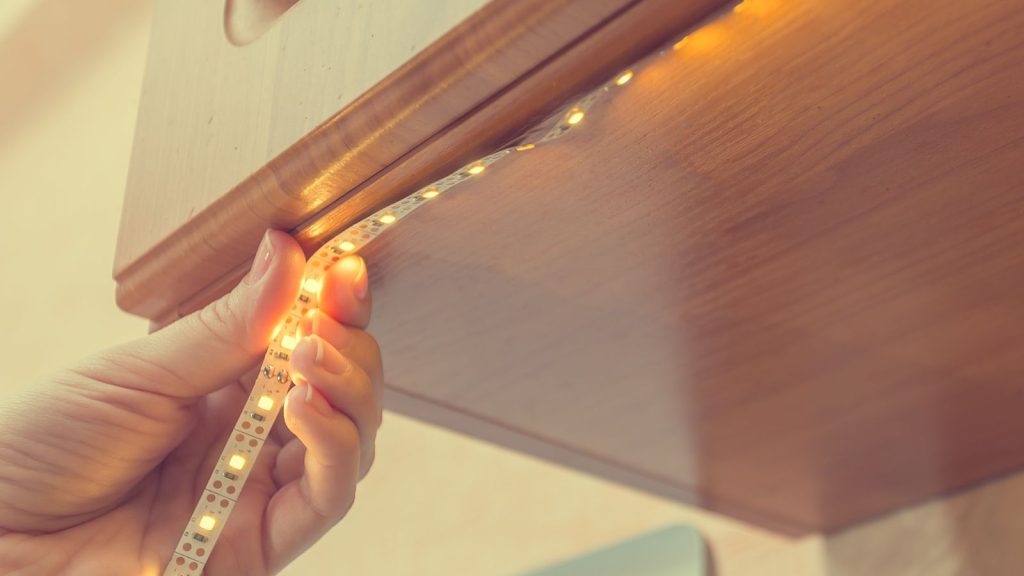 Installing led strip for lighting correctly on the surface of the Cabinet