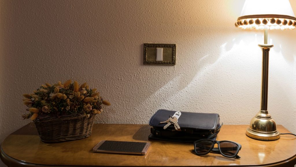 Keys, mobile phone and wallet at the entrance hall of the house