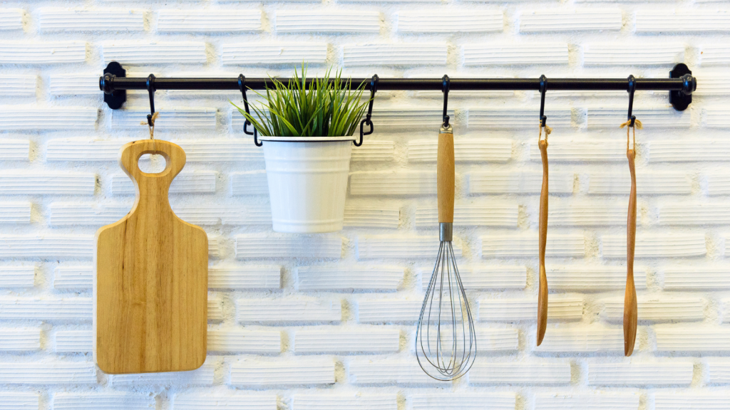 Kitchen Tools hang on the white brick wall