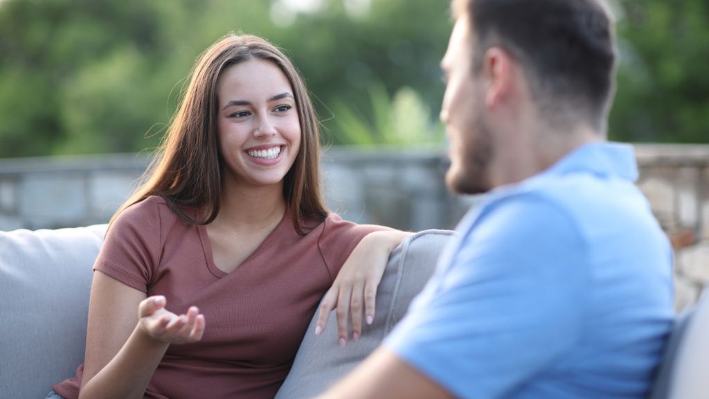 Man and woman talking in a terrace at home