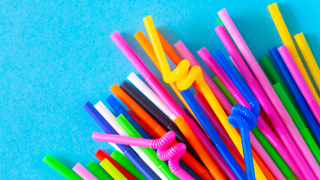 Plastic tubules for drinks on a blue background