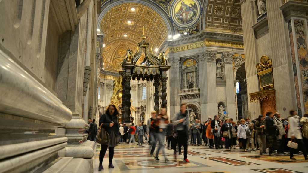 two persons in blurred running inside sistine chapel