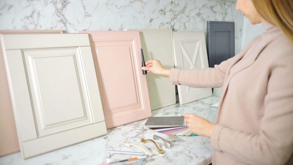 woman choosing cabinet handles