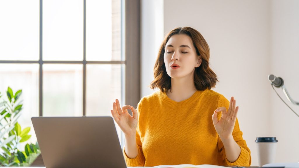 a woman deep breathing