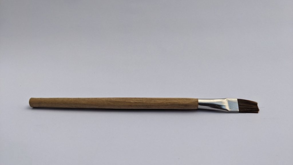 small wooden paintbrush