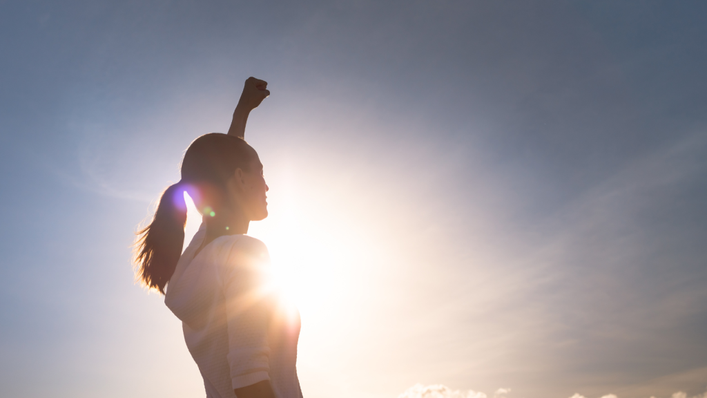 Strong female with fist up the sky. People strength, determination and power concept