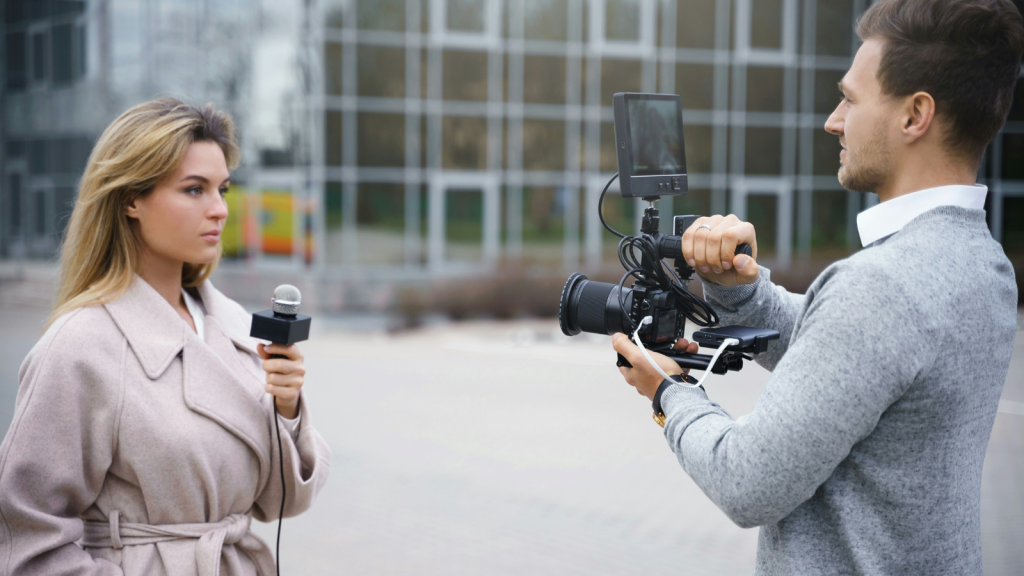 a news reporter and her cameraman
