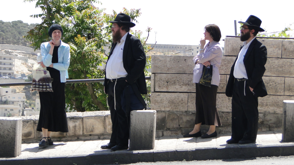 jewish couples at bus stop
