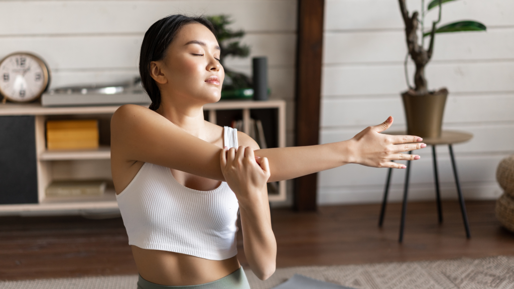 Woman stretching her shoulder