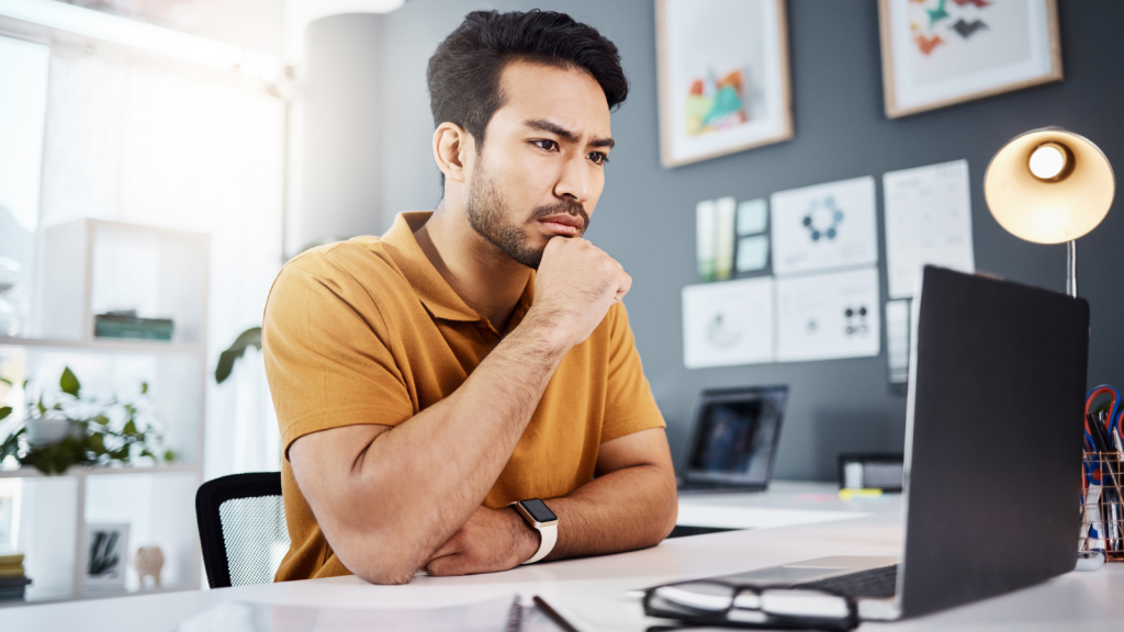 Man thinking in front of his computer