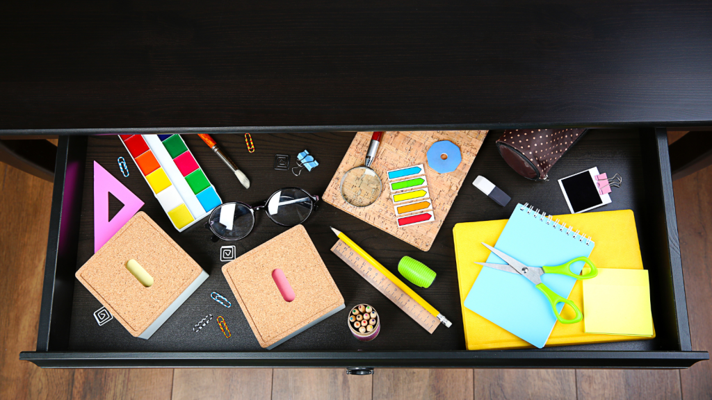 Messy desk drawer stationery