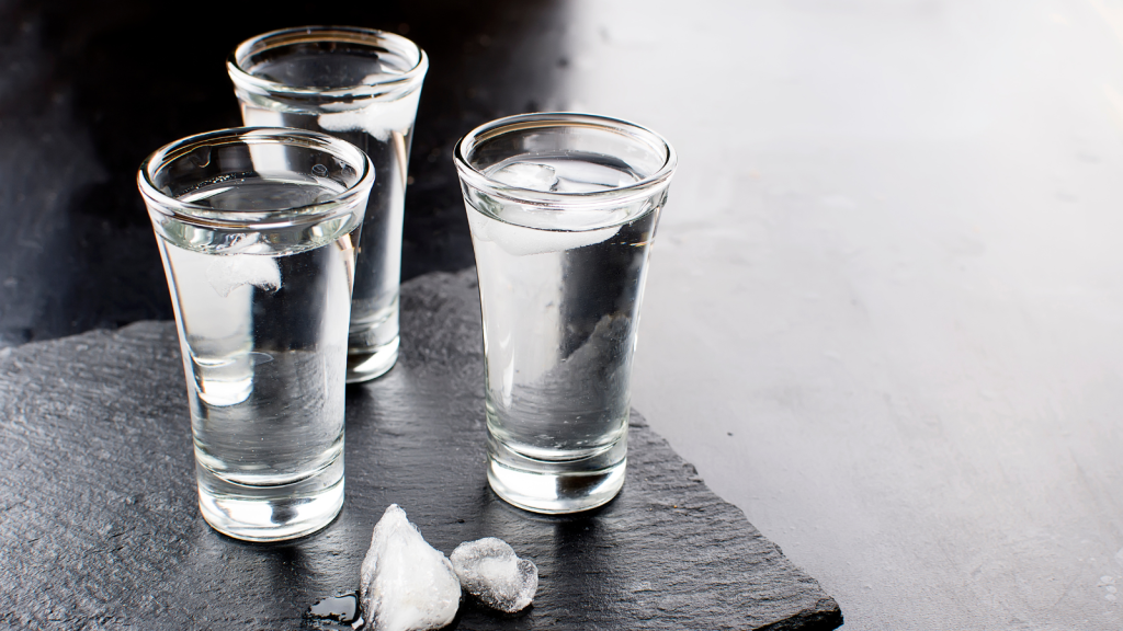 Vodka shots on black table