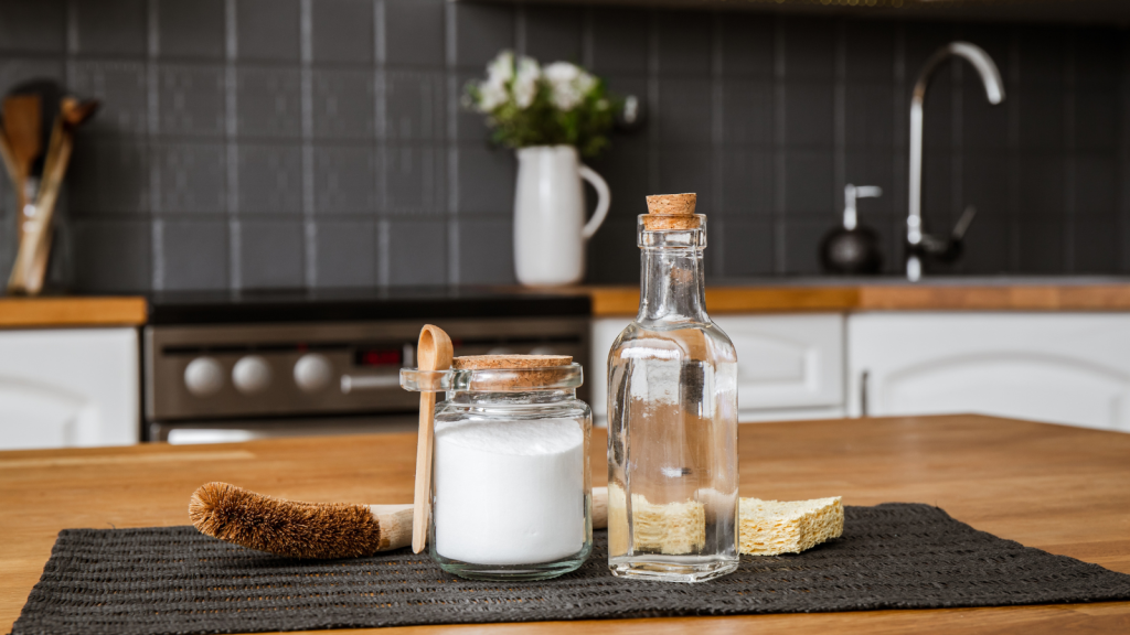 Using baking soda Sodium bicarbonate and white vinegar for home kitchen cleaning concept