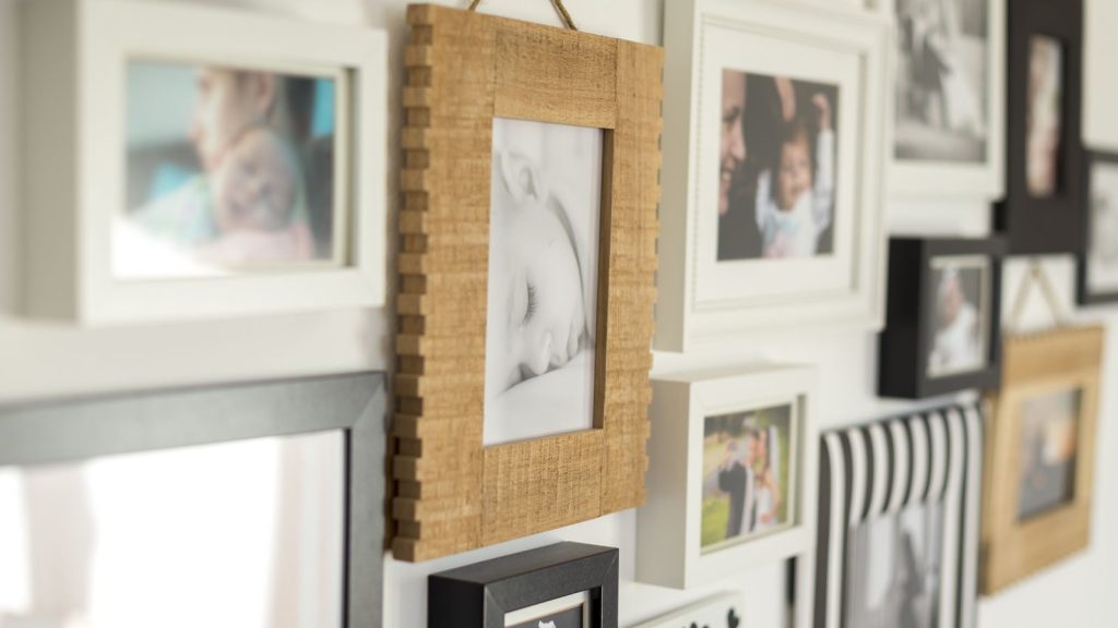 Wall with photos of the family in various photo frames