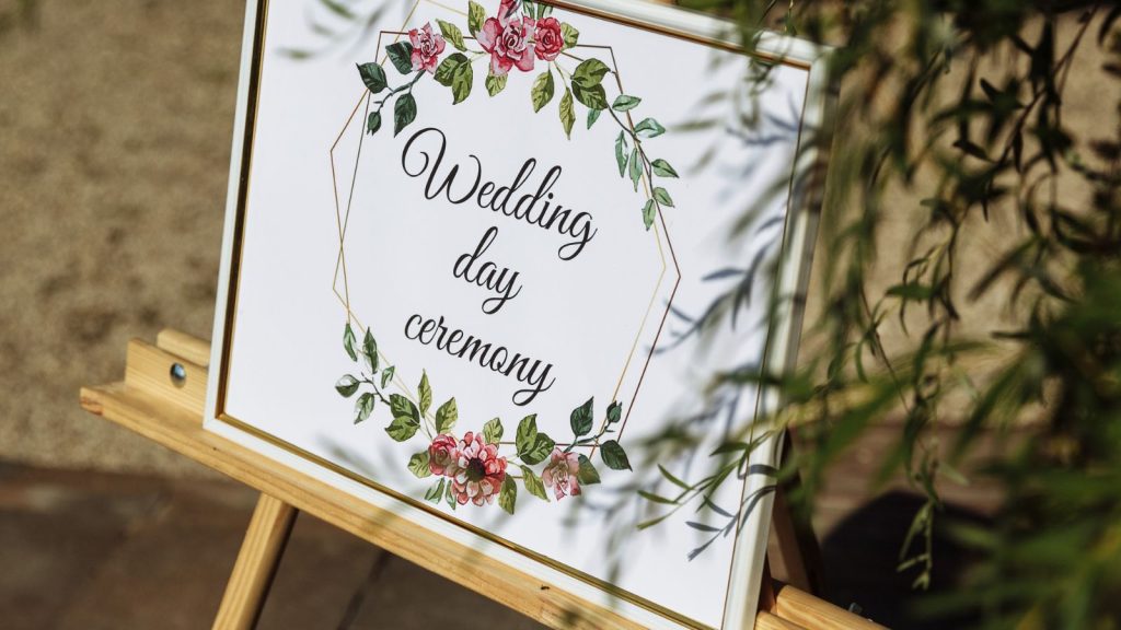 Wedding program displayed at the entrance