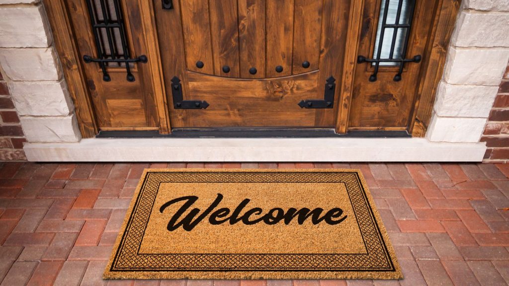 Welcome Mat At a Front Door Of House